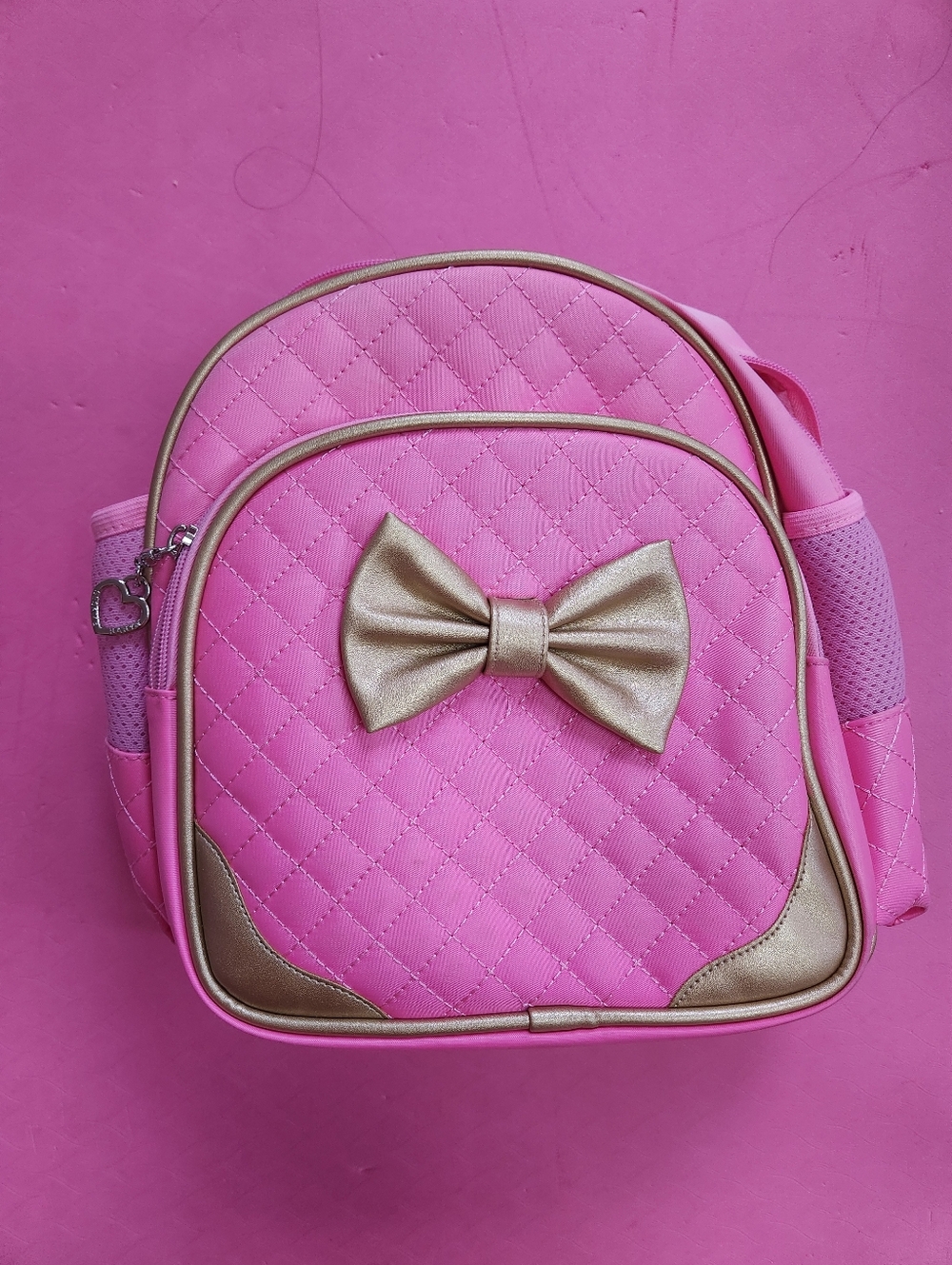 Pink Quilted Bow Backpack with Gold Accents
